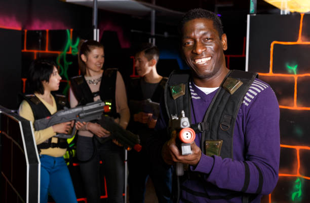 istock African laser tag player with gun ready for game 1342247281