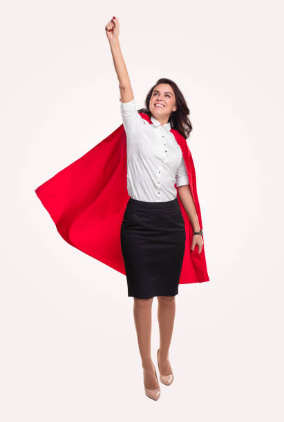 istock Powerful woman flying with red cape 1342248461