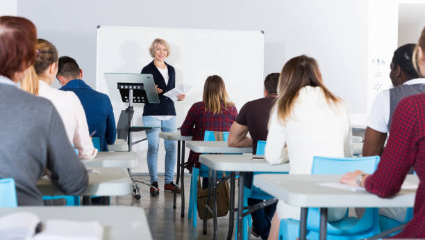 istock Female speaker giving presentation for students 1342249931