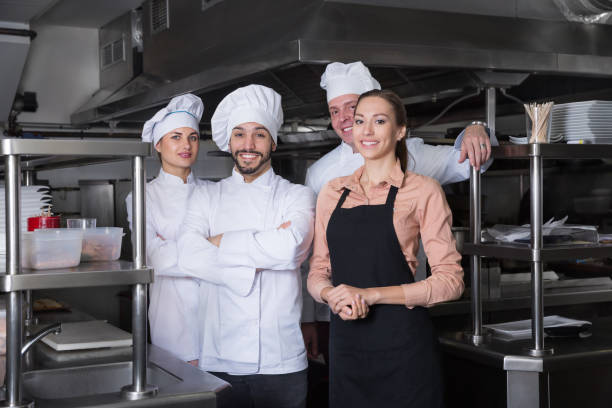 istock Team of restaurant staff posing together` 1342249952