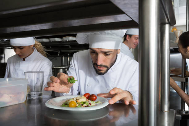istock Staff of restaurant with head chef working 1342249960