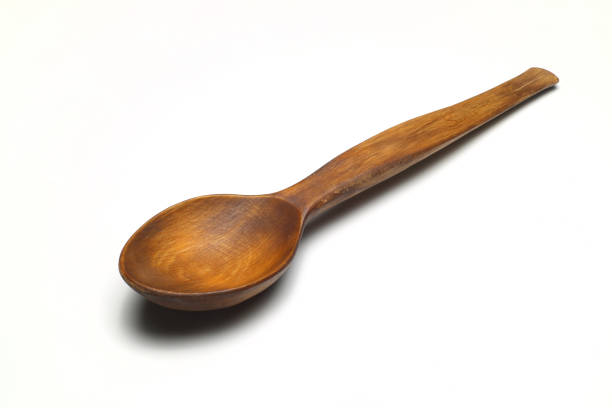 kitchenware arrangement with spatula wooden spoons and Ladles on wooden background in a row