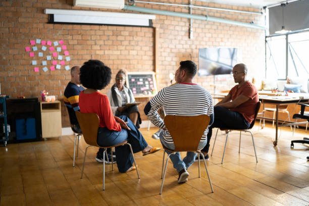 istock People in group therapy at a coworking 1342251834