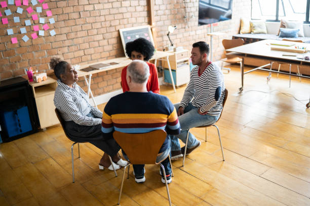 istock People in group therapy - including transgender person 1342251849