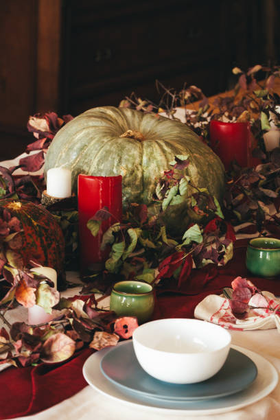 istock Fall thanksgiving decor with candle and pumpkins close up 1342251860