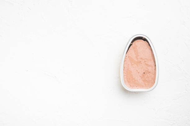 istock Chicken pate in opened aluminum packaging, on white stone table background, top view flat lay, with copy space for text 1342251953