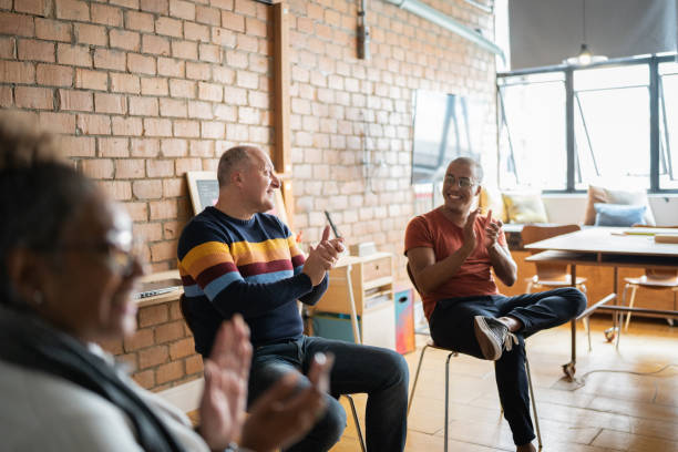istock People clapping in group therapy at a coworking 1342251977