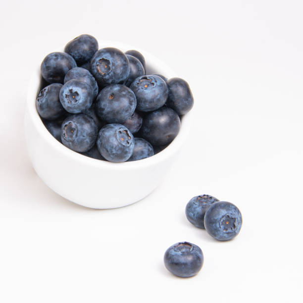 istock Fresh blueberry in white dish on the white background 1342252417