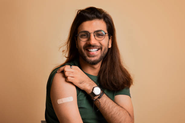 istock Closeup of smiling arab guy got vaccinated against coronavirus 1342252465