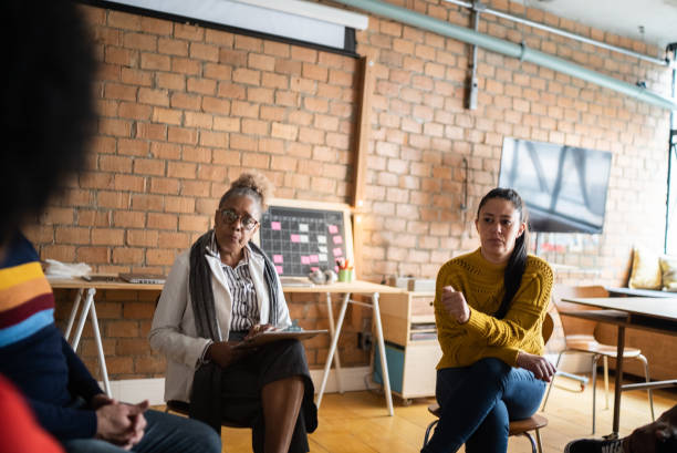 istock People in group therapy at a coworking 1342253387