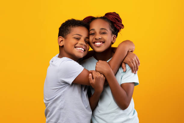 istock Loving black boy hugging his pretty sister 1342253847