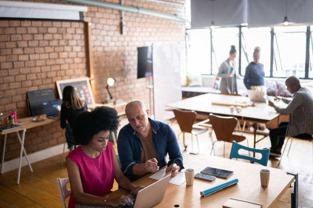 istock Colleagues working together at a coworking 1342254233