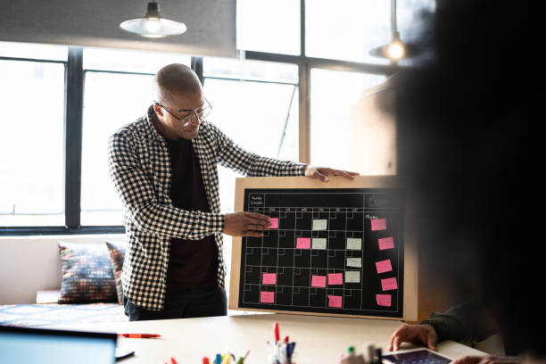 istock Young man talking in a meeting at a coworking 1342254552