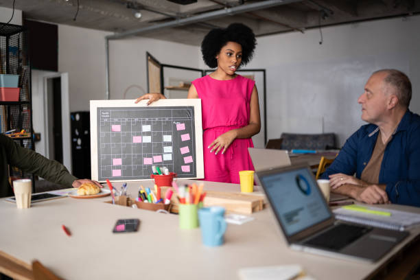 istock Young woman talking in a meeting at work 1342254578