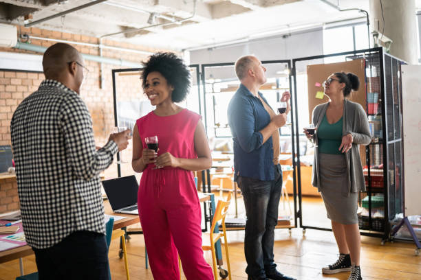 istock Colleagues socializing after work at a coworking 1342254628