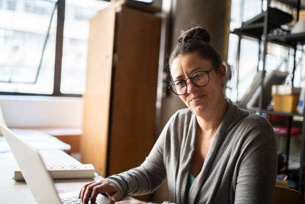 istock Portrait of a mature woman using laptop at work 1342254630