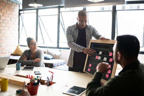 istock Young man talking in a meeting at a coworking 1342254644