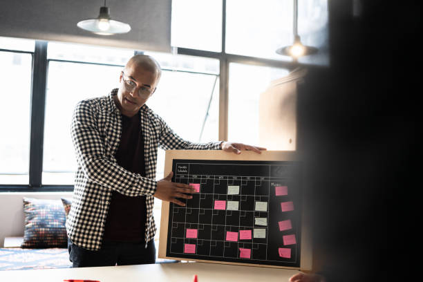istock Young man talking in a meeting at a coworking 1342254655