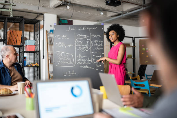 istock Young woman talking in a meeting at work 1342254718