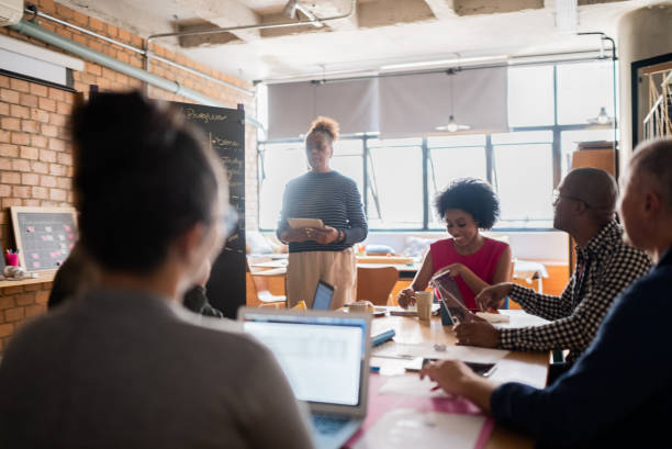 istock Senior woman talking in a meeting at work 1342255514