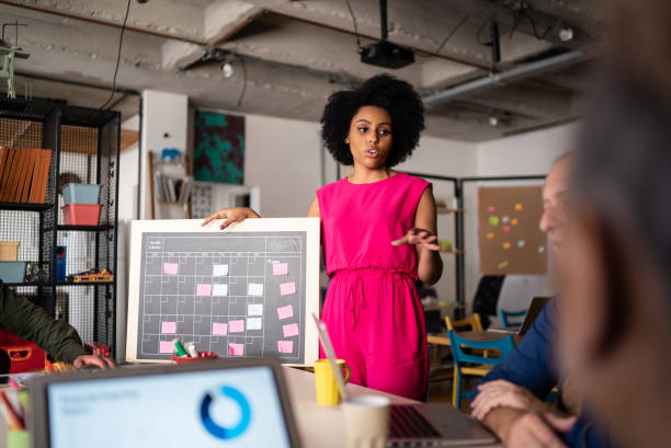 istock Young woman talking in a meeting at work 1342255582