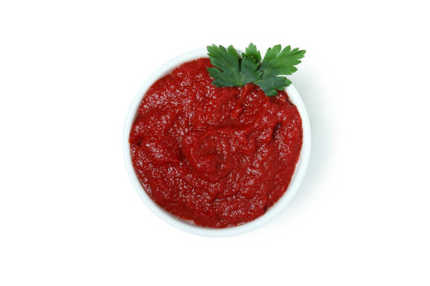 istock Bowl of tomato paste isolated on white background 1342255702