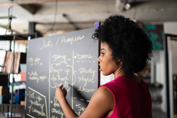istock Young woman talking in a meeting at work 1342255803