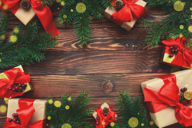 istock Christmas background with decorations and gift boxes on wooden table. Top view. Copy space.  Merry christmas and happy new year 1342256186