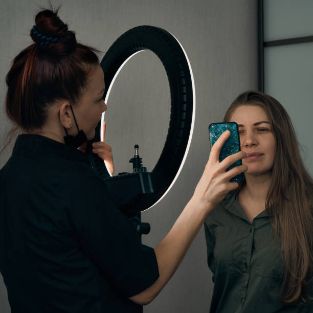 istock The permanent makeup master discusses the work with the client. The use of tools by a master for permanent eyebrow makeup. 1342259229