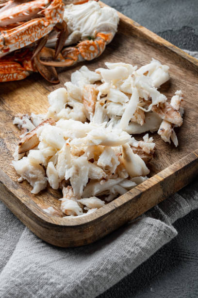 istock Boiled blue swimming crab parts, on gray background 1342259582