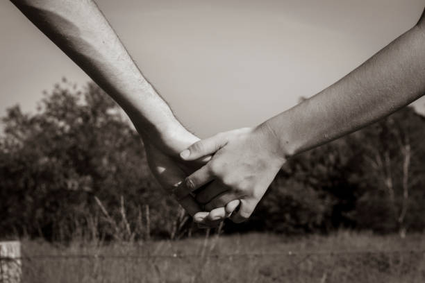 istock Romantic couple holding hands 1342259692