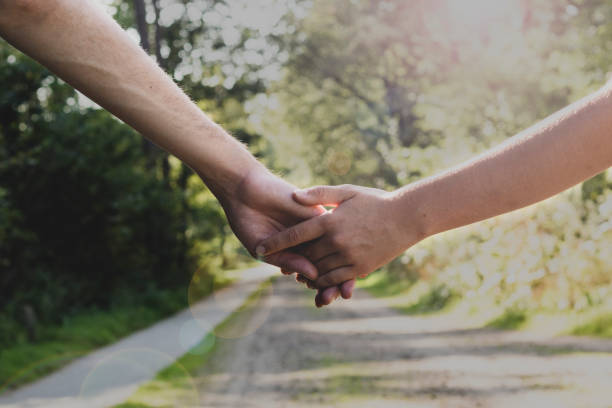 istock Romantic couple holding hands 1342259777