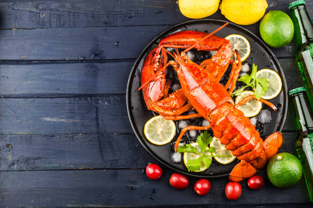 istock Seafood feastLemon and fresh Boston lobster on the ice 1342260277