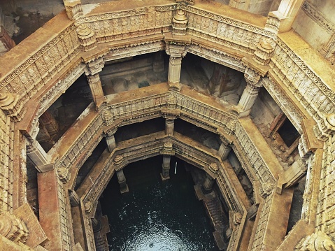 The entire structure is built in the architectural style of the Solankis and sandstone is used as the primary component. One of the most outstanding a defining feature of the step well is the octagonal shaped roof from where some light comes through but mostly protects the insides from harsh summer days and functions as a real oasis. The landings, levels and the roofs are present in the form of big openings which makes this place very breathable and airy. Another significant feature of the step well which sets it apart from the rest is the fact that it can be approached from 3 different main entries which are equally beautified. All the motifs, moldings and the carvings on the walls depict the deities, mythological creatures, flowers and tells us everything about the queen and the masons responsible for the creation of this magnificent structure that has been admired for centuries and generations.