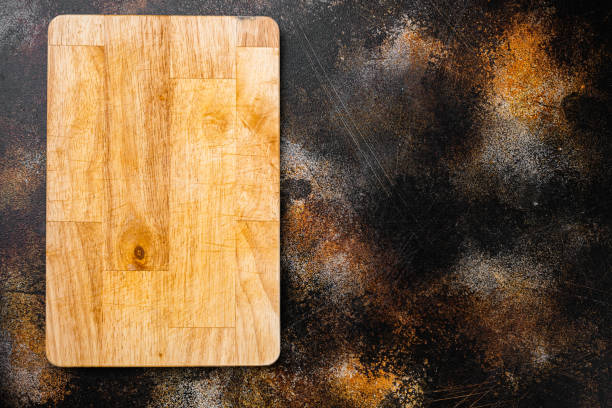 istock Empty vintage cutting board, on old dark rustic table background, top view flat lay , with copy space for text or your product 1342265889