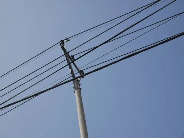 street power lines with blue sky background