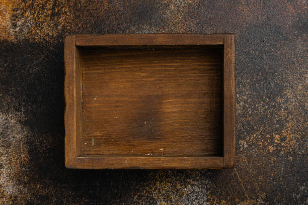 istock Empty dark wooden box with copy space for text or food, top view flat lay , on old dark rustic table background 1342265964