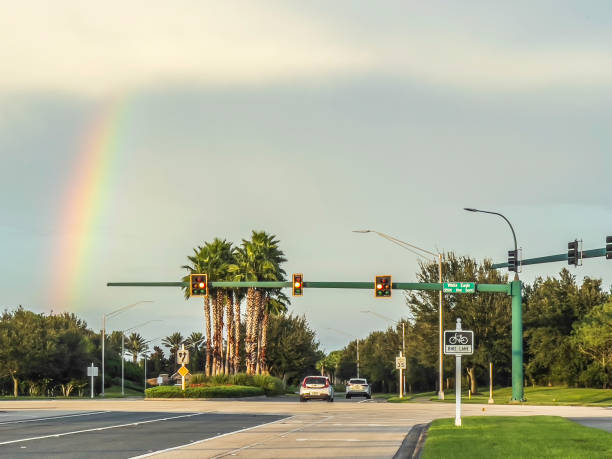 Cars chasing a rainbow stock photo