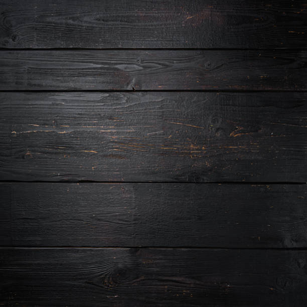 istock Empty wooden real background, square format, top view flat lay , with copy space for text or food black wooden table background 1342267314