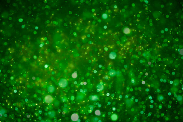 istock christmas glitter green background with bokeh 1342267331
