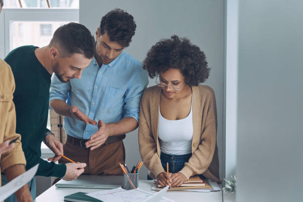 istock Confident business team having quick meeting 1342270267