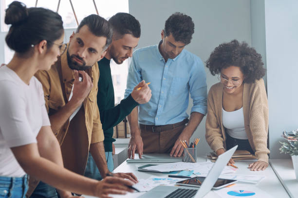 istock Confident business team having quick meeting 1342270334