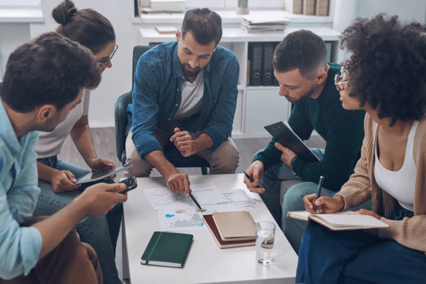 istock Top view of confident business team analyzing data 1342270513