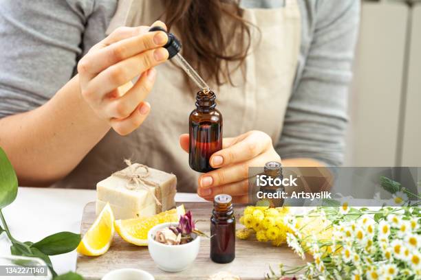 Woman Performing Professional Cosmetics Research Concept Of Natural Organic Ingredients In Dermatology Essential Oil Extract Of Herbs Fruits Vegetables Natural Moisturizing Body Face Care Stock Photo - Download Image Now