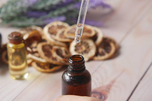 istock Drop falls from a pipette into a cosmetic bottle 1342273922