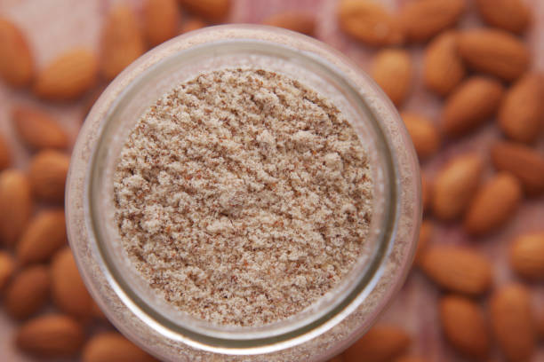 istock almond powder in a jar and almond on table 1342277024