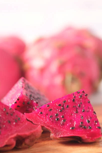 istock slice of dragon fruit on a chopping board. 1342279086