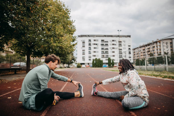 istock Friends do warm-up exercises 1342279230