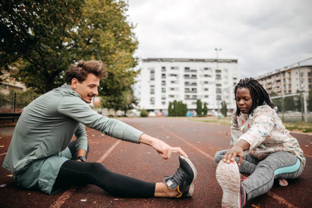 istock Friends do warm-up exercises 1342279232