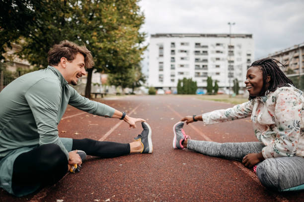 istock Friends do warm-up exercises 1342279334
